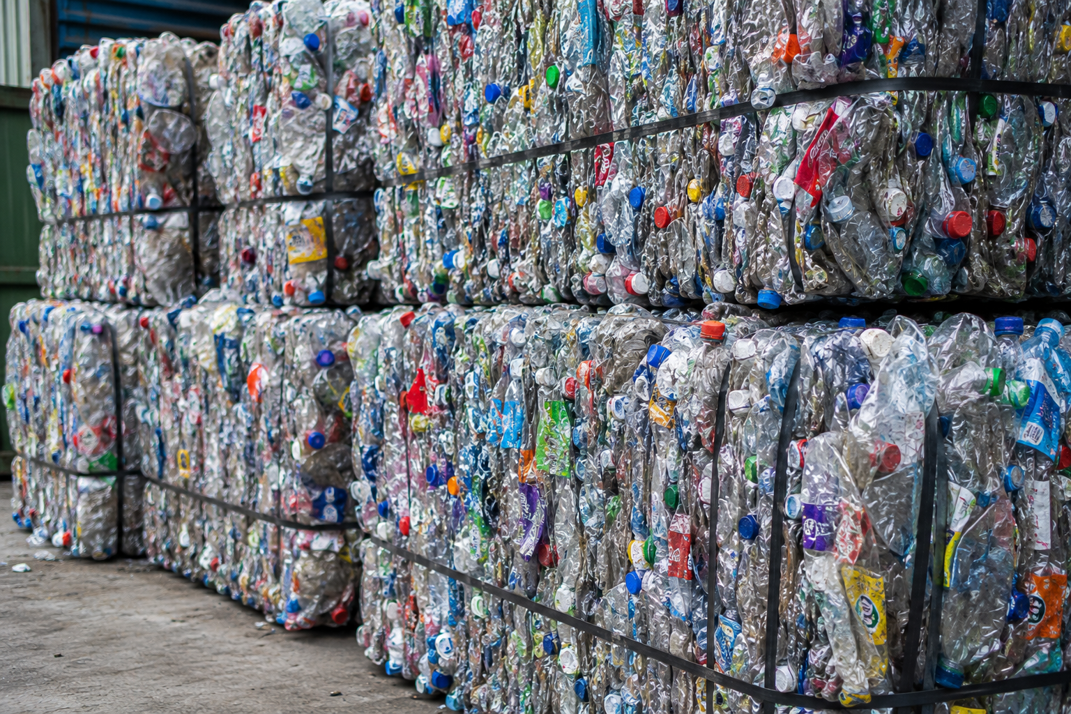 Plastic waste being sorted and processed for recycling into reusable raw materials